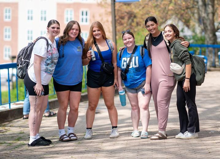 Six students posing on campus