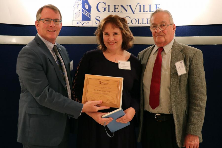 Outstanding Teacher Award recipient Tonya Propst with President Pellett (left) and award presenter Professor Emeritus Harry Rich (right)