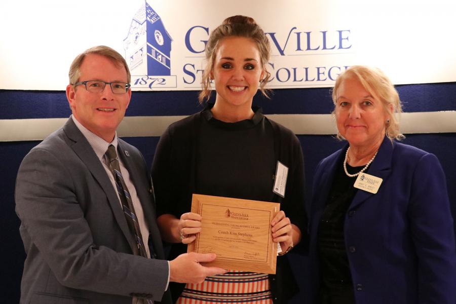 Outstanding Young Alumna award recipient Coach Kim Stephens with President Pellett (left) and award presenter Professor Emerita Janet Bailey (right)