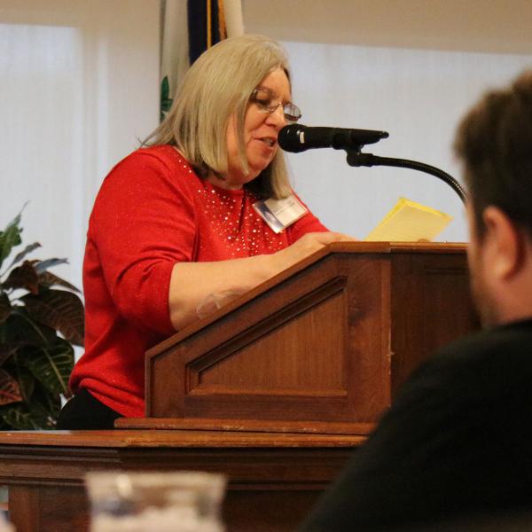 Debbie Nagy addresses those gathered at the Alumni Banquet