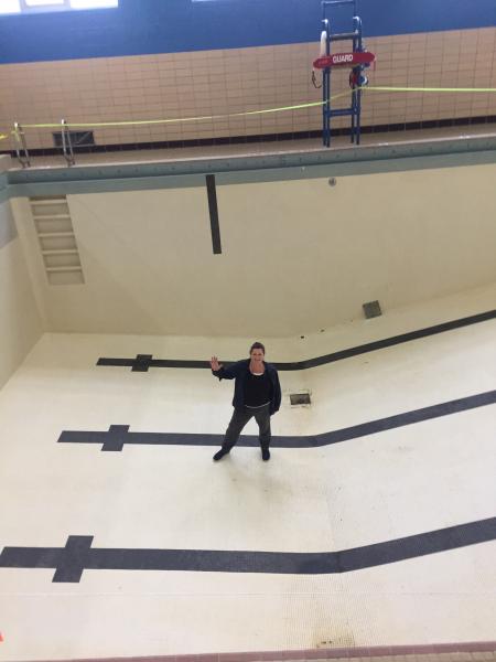 Aquatics and Recreation Director Kathy Gilbert stands in the empty deep end of GSC's pool when it was drained and cleaned earlier this year