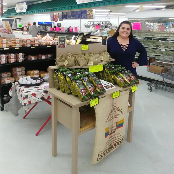 Kimmy Little with the Aroma of the Andes display inside the Glenville Foodland during a coffee sampling event