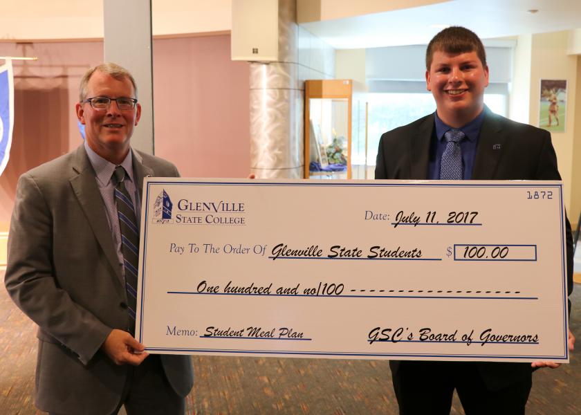 Dr. Pellett (left) and Student Government Association President Cameron Woods (right) with the ceremonial check made payable to GSC students