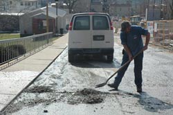 Jim Tatman shovels debris