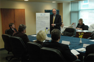 Jim Spears displays copy of open letter from Hidden Promise Consortium