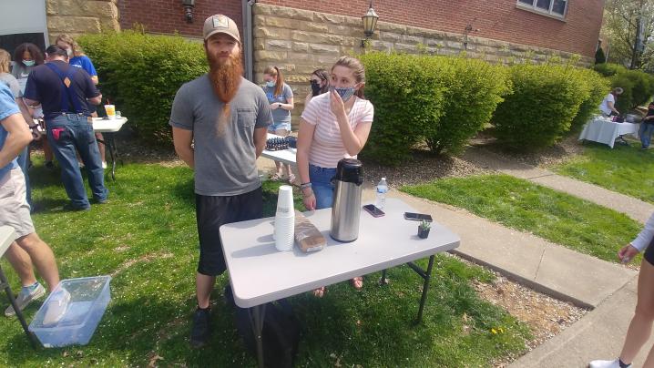 Students offering Pine Needle Tea