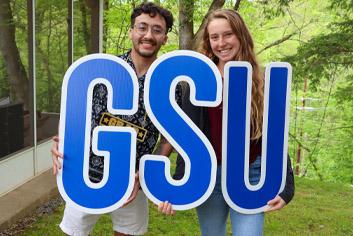 Students Holding GSU letters
