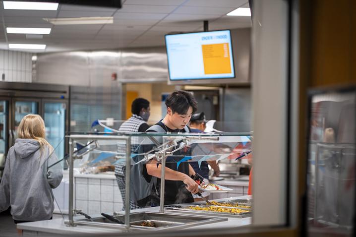 Student getting food in the dining hall