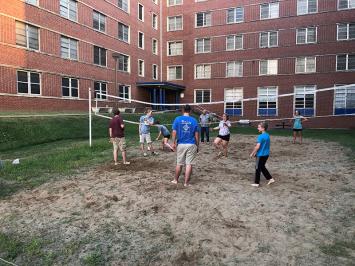 Club members playing a game of volleyball