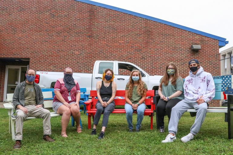 (l-r) Chris Cosner, Carla Bowman, Zoe Yates, Clair Amos, Brianna Deel, and Hayden Coon with a few of the benches that were refreshed by the GSC Art Society (l-r) Chris Cosner, Carla Bowman, Zoe Yates, Clair Amos, Brianna Deel, and Hayden Coon with a few of the benches that were refreshed by the GSC Art Society (GSC Photo/Kristen Cosner)