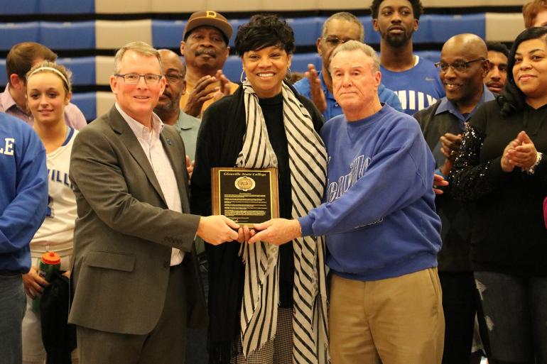 GSC President Dr. Tracy Pellett (left) and Former GSC Coach Tim Carney (right) presenting Sharon Minnieweather (center) with a plaque commemorating the event GSC President Dr. Tracy Pellett (left) and Former GSC Coach Tim Carney (right) presenting Sharon Minnieweather (center) with a plaque commemorating the event