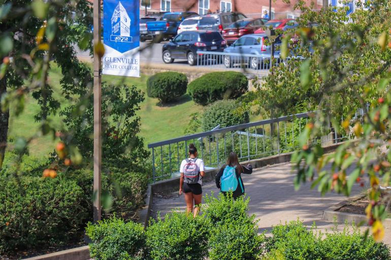 Students walk through campus between classes Students walk through campus between classes