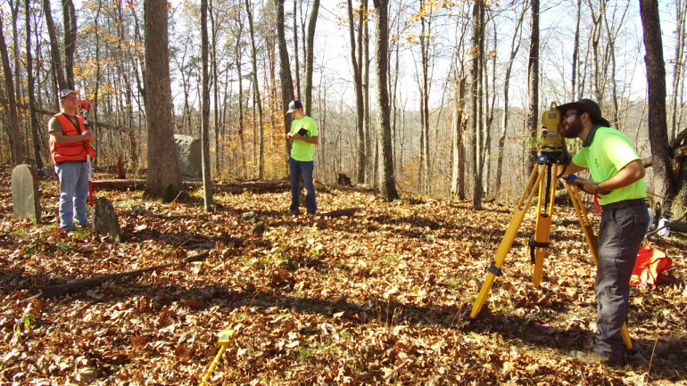 Glenville State College Honors Program students (l-r) Eli Henthorn, Asa Dick, and Jacob Amick survey a family cemetery in rural Gilmer County.