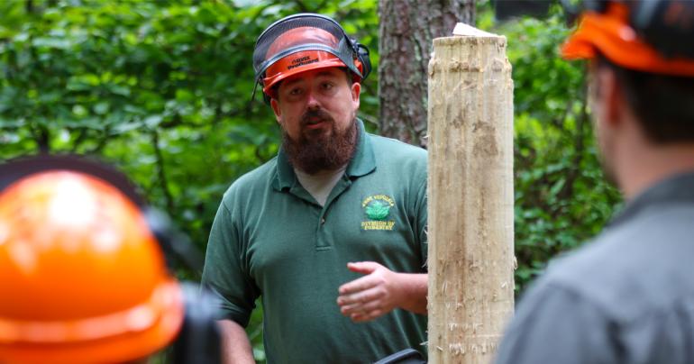 West Virginia Division of Forestry Forester Johnny King discusses cutting technique and chainsaw safety with Glenville State University students during a recent workshop. (GSU Photo/Dustin Crutchfield)