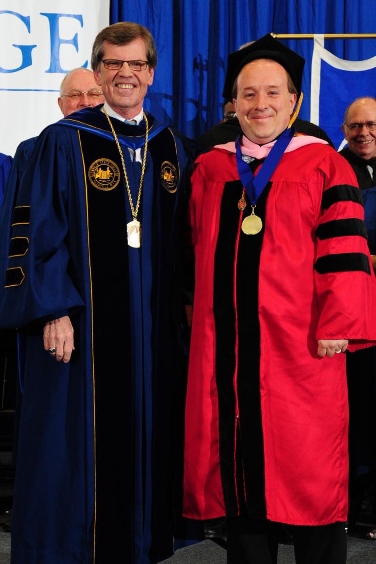 President Barr with Dr. Lloyd Bone (right), the Faculty Award of Excellence recipient for 2017