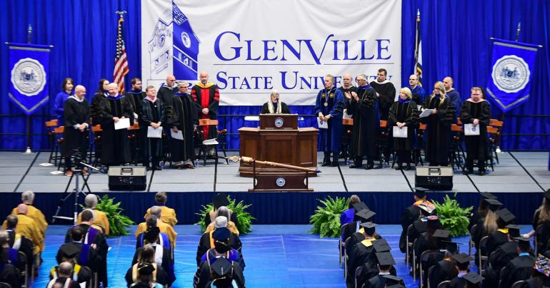 Glenville State University Associate Provost Dr. Mari Clements (at podium) recognizes members of the platform party during the commencement ceremony on Saturday, May 6. (GSU Photo/Sam Santilli)