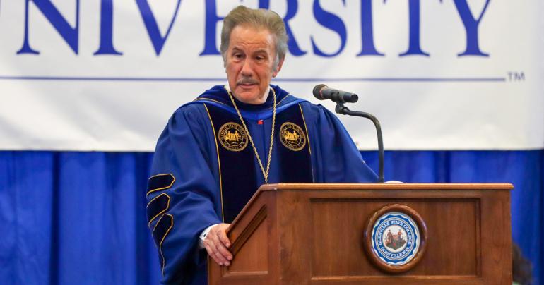 Glenville State University President Dr. Mark A. Manchin at the podium during a previous Commencement Ceremony. Manchin will confer degrees upon graduates at the end of this semester on Saturday, December 10 at Glenville State’s Waco Center. (GSU Photo/Kristen Cosner)
