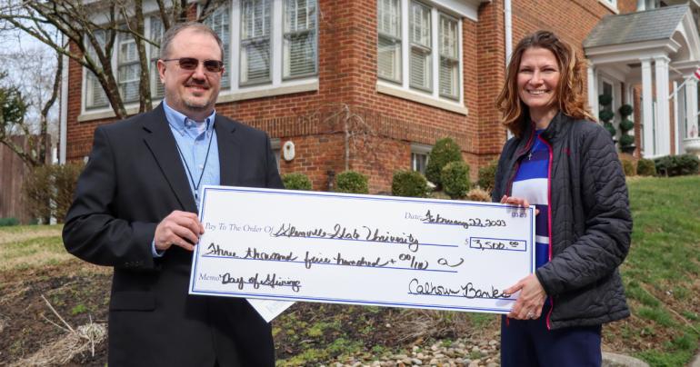 Day of Giving 2023 Calhoun Banks Chris Arden, Chief Financial Officer and Senior Vice President at Calhoun Banks, joins Glenville State University’s Director of Fundraising Vada Woodford for a check presentation. Calhoun Banks was among the 800+ donors who contributed to Glenville State’s annual Founders Day of Giving. (GSU Photo/Dustin Crutchfield)