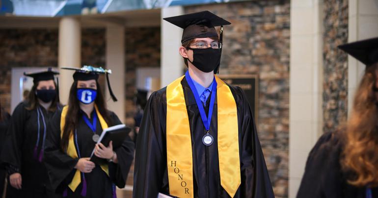Prospective Glenville State College graduates exit the Waco Center following the Commencement Ceremony held on Saturday, November 21 (GSC Photo/Kristen Cosner)