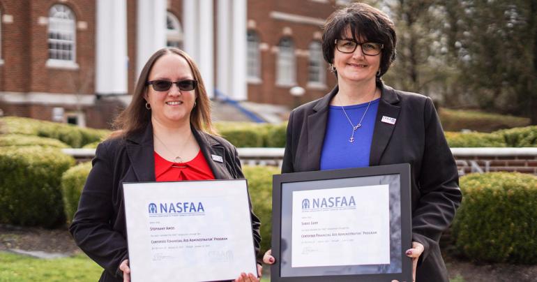Glenville State University Financial Aid staff members Stephany Amos (left) and Sheri Goff with their FAAC® certificates. (GSU Photo/Kristen Cosner)