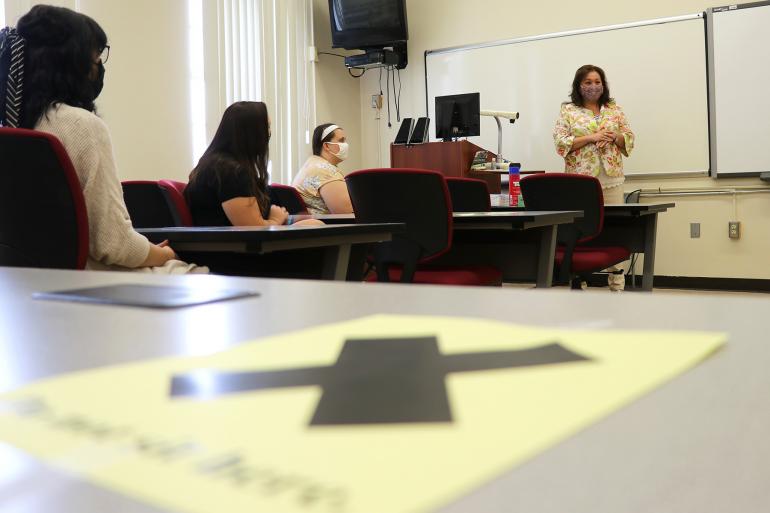 Glenville State College students in one of Connie Stout O’Dell’s (standing) classes meet for the first time on Monday, August 17
