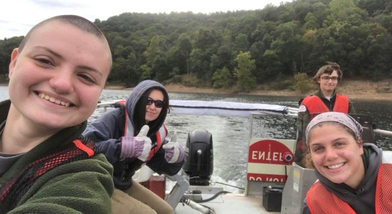 Forestry Club at Tygart Lake Glenville State University students Chloe Richardson, Ciera Heine, and Della Moreland with US Army Corps of Engineers Ranger Lexi Pletcher (right). The group gathered at Tygart Lake on National Public Lands Day to pick up trash. (Submitted photo)