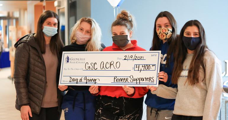Founders Day 2021 Members of the Glenville State College Acrobatics and Tumbling team with a generous donation to their organization as part of the Day of Giving that took place on Friday, February 19