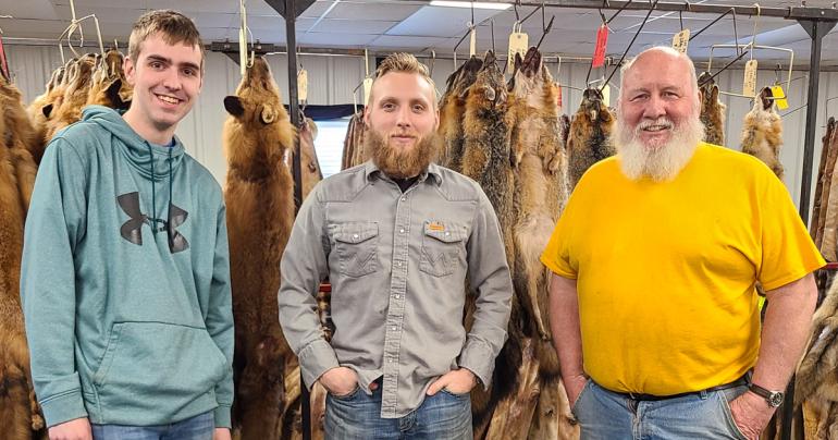 (l-r) Evan Jedamski, Jacob Petry, and Tom Snyder at the WV Trappers Association Fur Auction.