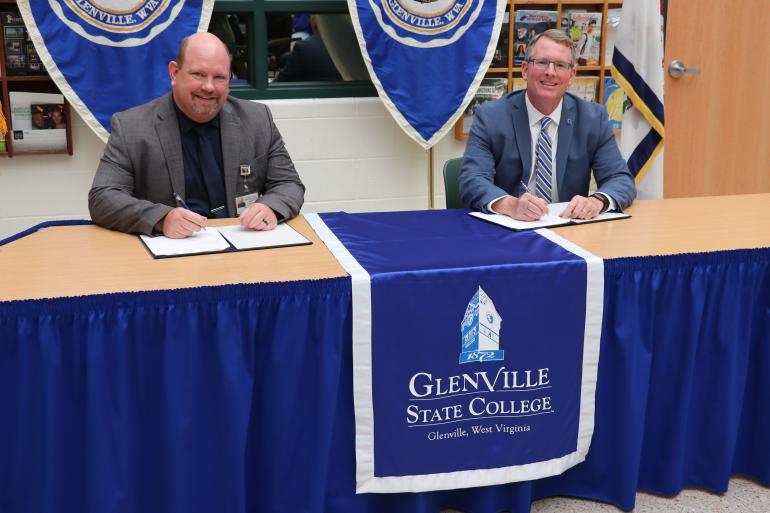 Braxton County Schools Superintendent David Dilly and Glenville State College President Dr. Tracy Pellett at the signing ceremony