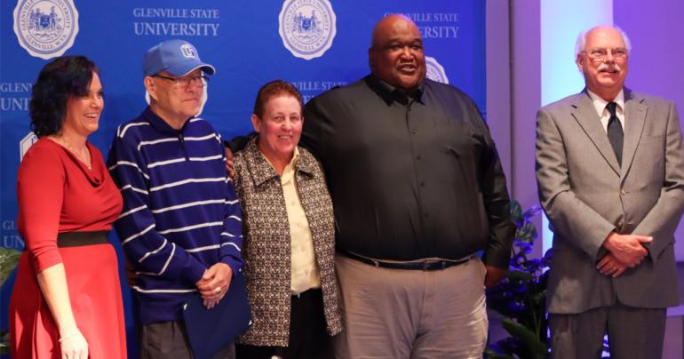 Glenville State University’s Curtis Elam Athletic Hall of Fame inductees for 2022 (l-r) Sarah Tingler representing Glenard Vannoy, Jim Scott, Kim West, Brian Hill, and Mark Gainer representing Earl “Tex” Gainer. Not pictured is Mike Eberbaugh. (GSU Photo/Dustin Crutchfield)