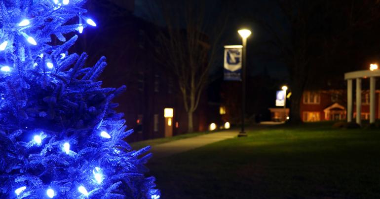 A tree decorated with Pioneer blue lights stands on Clark Hall Lawn (GSC Photo/Dustin Crutchfield)