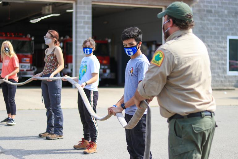 Glenville State Land Resources students work with WVDOF Service Forester Jesse King (far right) Glenville State Land Resources students work with WVDOF Service Forester Jesse King (far right) (GSC Photo/Kristen Cosner)