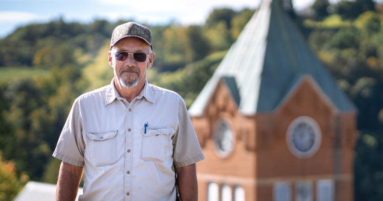 Jim Tatman Glenville State University Trades Specialist Jim Tatman with the historic Administration Building Clock Tower behind him. (GSU Photo/Kristen Cosner)