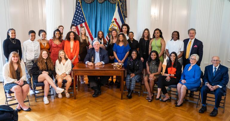 Members of the Glenville State University Lady Pioneers 2022 NCAA Division II Women’s Basketball National Champion team with West Virginia Governor Jim Justice, Glenville State University President Dr. Mark A. Manchin, and longtime Glenville State supporters Ike and Sue Morris. | Photo Courtesy WV Governor's Office