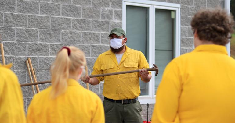 Land Resources Certification Opportunities WVDOF Forester Jesse King (center) reviews different types of wildfire fighting hand tools with GSC students (GSC Photo/Kristen Cosner)