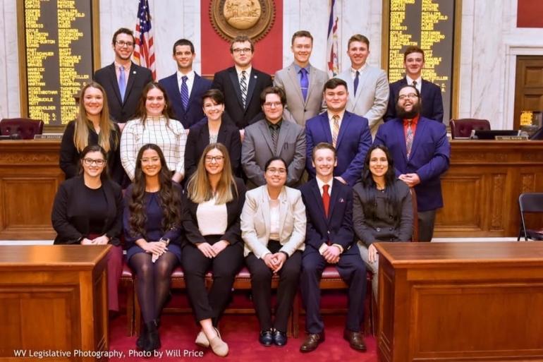 Glenville State College student Fairan Gill (second from left, middle row) poses for a group photo alongside the other Frasure-Singleton Interns inside the West Virginia House Chamber | WV Legislative Photography Photo by Will Price