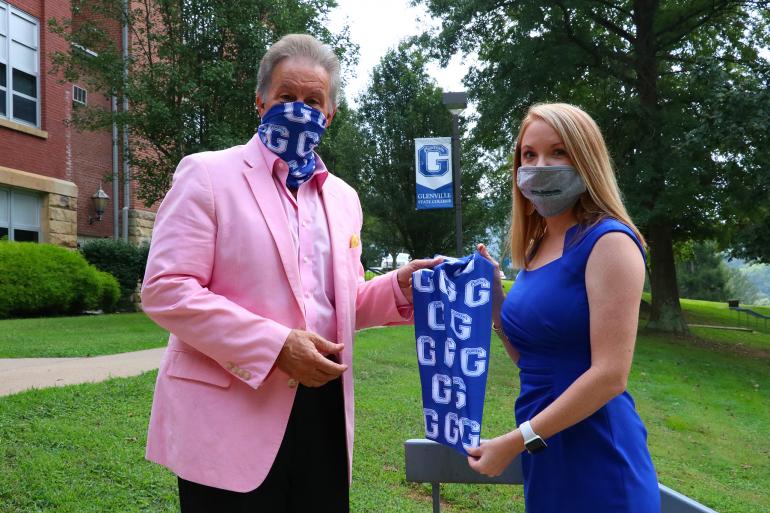 Glenville State College President Dr. Mark Manchin (left) accepts a donated face covering from Minnie Hamilton Health System Director of Business Development Brittany Frymier (right) Glenville State College President Dr. Mark Manchin (left) accepts a donated face covering from Minnie Hamilton Health System Director of Business Development Brittany Frymier (right) (GSC Photo/Dustin Crutchfield)
