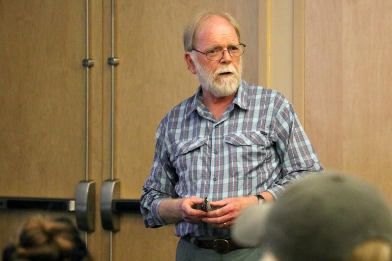 Dr. Michael E. Nelson speaking at his presentation Dr. Michael E. Nelson speaking at his presentation