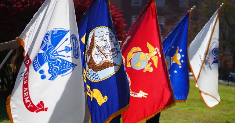 Various flags from branches of the U.S. Armed Forces on display at a past Glenville State University event. A Military Appreciation Ball is being planned by Glenville State’s Student Veterans Association for April 15. (GSU Photo/Kristen Cosner)