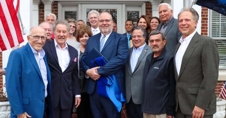 Paul Hardesty Honorary Degree Surrounded by family, friends, and colleagues, West Virginia Board of Education President Paul Hardesty (center) was recently presented with an honorary degree from Glenville State University. (GSU Photo/Dustin Crutchfield)