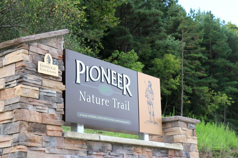A three-dimensional sign, donated by Don and Glendora Hedley, marks the beginning of the Pioneer Nature Trail