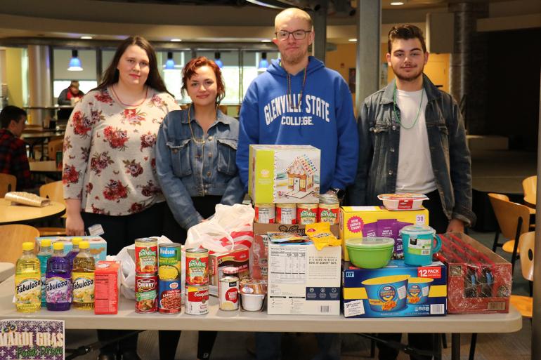 Glenville State College students who assisted with the Hidden Promise Scholars and Heart of the CommUnity Food Drive for the Pioneer Pantry included (l-r) Stormie Alverson, Brigitte Ellison, Tyler Moore, and Trey Waycaster (GSC Photo/Kristen Cosner)