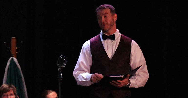 Dr. Donal Hardin at the microphone at a previous reader's theater production. The Glenville State College Players will perform Arthur Miller's All My Sons at GSC April 22-24. (GSC Photo/Kristen Cosner)