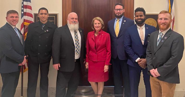 (l-r) Glenville State University’s Veteran Certifying Official Charles Yakubow, Marshall University SVA Chapter Associate Amond Bailey, Marine Corps veteran and Nicholas County Commissioner Gary Roberts, Senator Shelly Moore Capito, Marine Corps veteran and Marshall University SVA President Jamie Springston, Navy veteran and Marshall University SVA Chapter Associate Jaden Gilpin, and Army veteran and Glenville State University SVA President Keith Hardisty. (Courtesy photo)