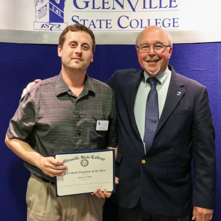 Glenville State College Staff Employee of the Year Jason Gum (left) with John Beckvold