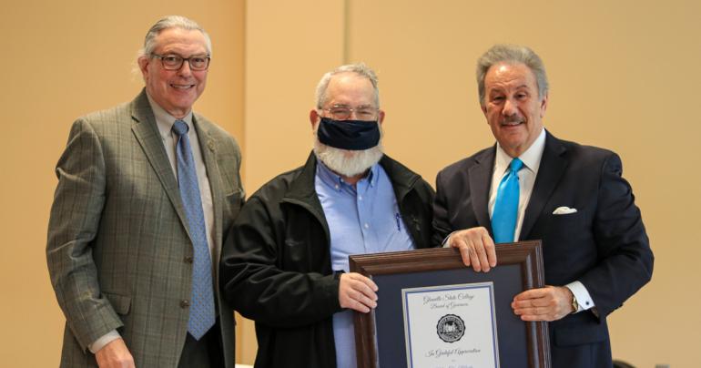 Glenville State College Board of Governors Chair Mike Rust and President Dr. Mark Manchin present Tim Marks (center) with a Certificate of Appreciation in recognition of his years of service to the institution.