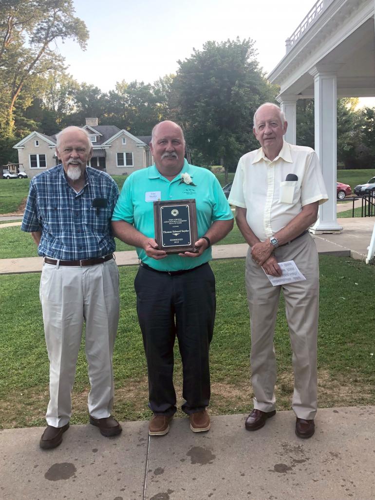West Virginia Agriculture and Forestry Hall of Fame inductee Tom Snyder (center) is flanked by fellow inductees and Glenville State College Department of Land Resources legends Ed Grafton and Rick Sypolt