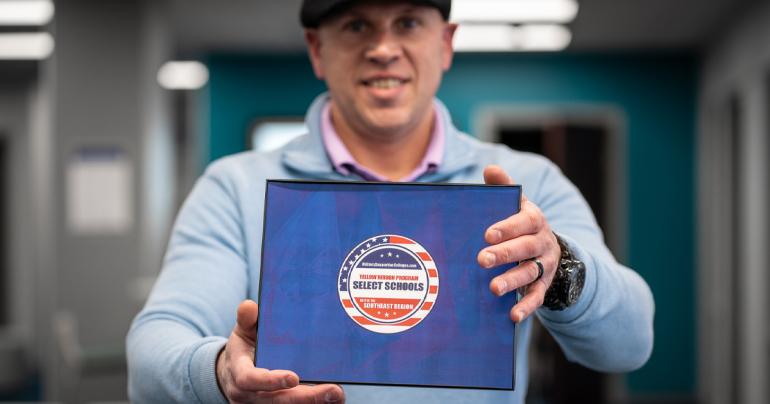 Yellow Ribbon Recognition 2023 Glenville State University’s Veteran Certifying Official, Charles Yakubow, holds a badge recognizing Glenville State as a select Yellow Ribbon Program school. (GSU Photo/Kristen Cosner)