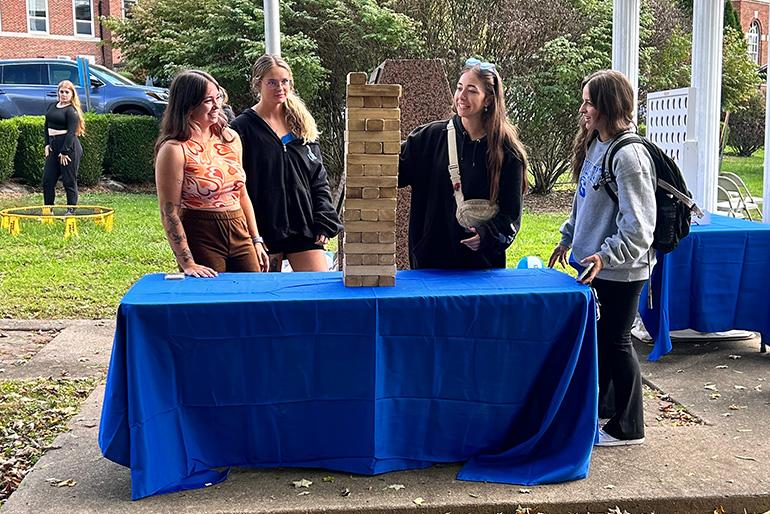 Students playing Giant Jenga