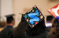 The decorated cap of Glenville State University graduate Haley Cottrill, pictured here at the spring commencement ceremony in May 2021, stands out among a sea of Pioneer graduates. The spring 2022 ceremony will take place on Saturday, May 7 at 10:00 a.m. in the Waco Center.
